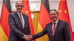 German chancellor warns of trade imbalance with China during first Beijing trip