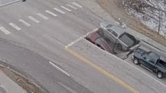 Watch: Moment a sinkhole in Omaha traps cars and drivers