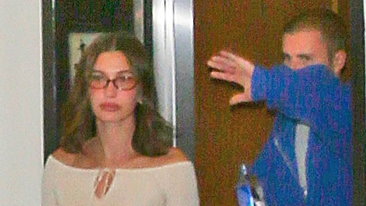 Justin Bieber caught on camera throwing water bottle at photographer during tense exit with wife Hailey