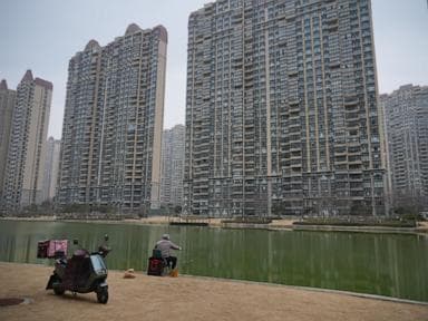 As China's economy slows, some are snapping up cheap apartments to 'retire' early