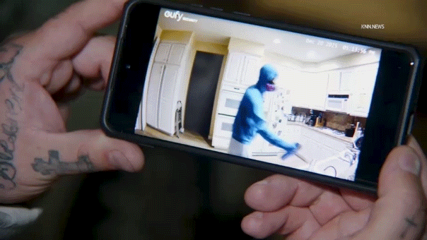 Video appears to show gas mask-wearing roommate allegedly spraying poison on couple's food